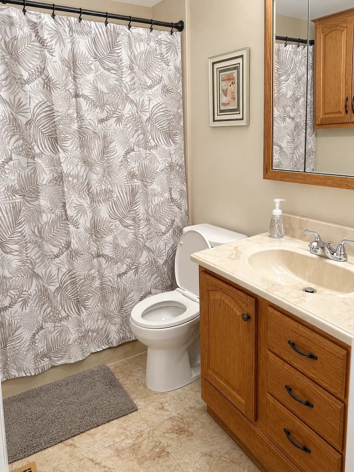 Full bathroom with a shower curtain, toilet, and vanity