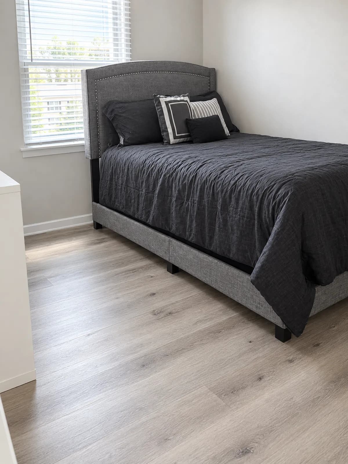 Bedroom with a queen bed and gray bedding